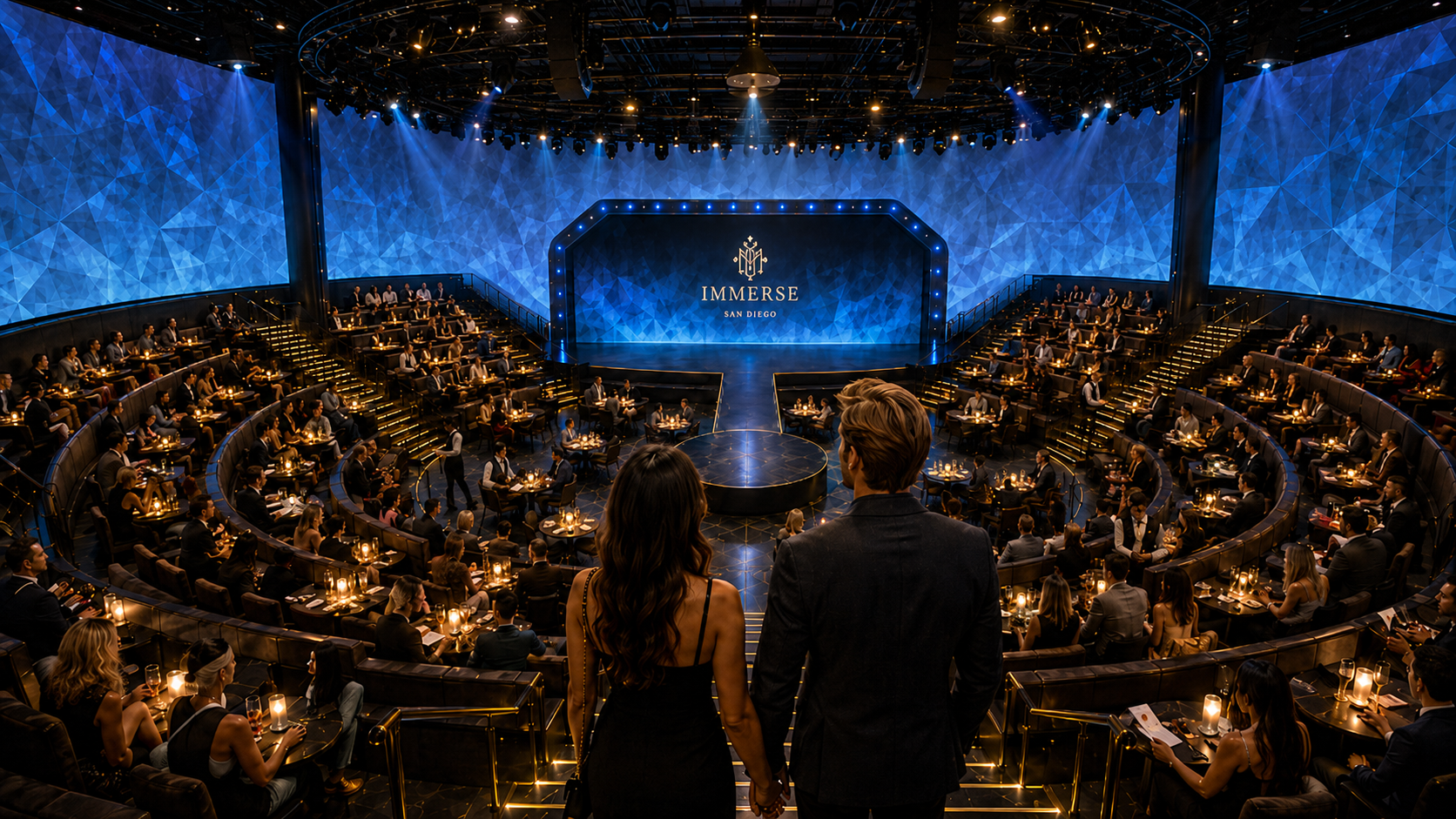 Immerse San Diego theater in the round — a couple overlooking a circular stage with the Immerse crest, surrounded by candlelit tables and blue projection-mapped walls